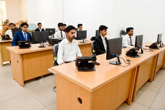 SiOnline support desks, with staff at computers and desk phones