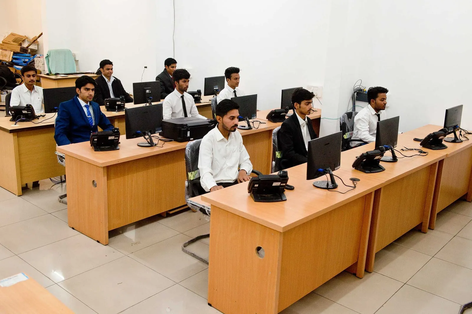SiOnline team members at workstations across the support floor
