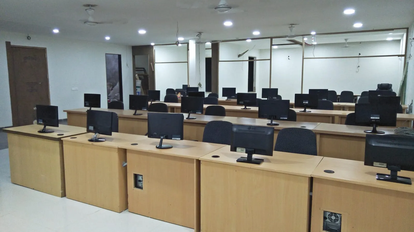 The SiOnline office floor, empty, showing rows of workstations